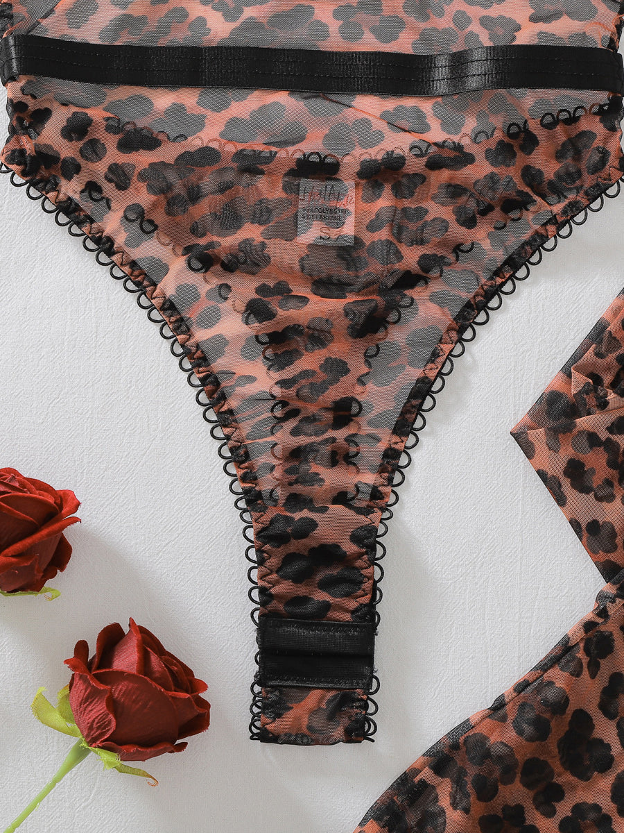 Sexy sheer leopard-print bodysuit featuring a bow, open-crotch design, gloves, and thigh-high stockings.